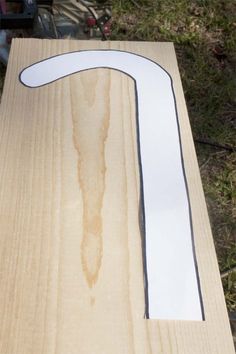 a piece of wood that has been cut out to look like the letter t on it