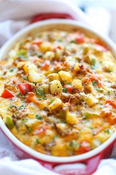 a casserole dish with potatoes and vegetables in it