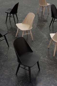 several chairs arranged in a circle on the floor