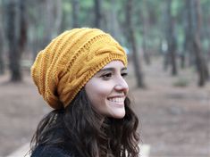 "Protect yourself from the elements in a cozy, rib-knit beanie crafted with a face-framing fit. This type of pattern has a good deal of stretch to it, and will fit a broad range of sizes. If you have any concern, please contact me and let me know about your head size. Material : In this project, The yarn I used is very high quality, 50% wool, 50% Acrylic. Color : Mustard You can add another color of this hat in this link: https://www.etsy.com/shop/SENNURSASA?section_id=8144014 or a matching scar Knit Hats For Women, Yellow Beret, Knitted Slouch Hat, Yellow Beanie, Knit Winter Hat, Oversized Hat, Slouchy Beanie Hat, Winter Boho, Hand Knit Hat