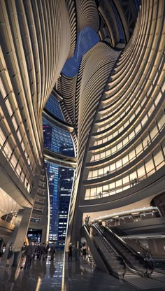 the inside of a building with people walking around