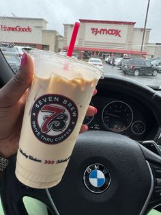 A medium iced Blondie coffee from 7 Brew Coffee held in front of a BMW steering wheel with TJ Maxx and HomeGoods storefronts visible through a rainy windshield. Rainy Day Coffee, Creamy Coffee, Coffee Run, Brew Coffee, Cozy Vibes, A Rainy Day, Coffee Brewing, Shopping Trip