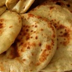 there are several pita breads on the plate