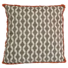 a gray and white pillow with an orange border on the bottom, in front of a white background