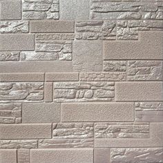 a white brick wall that is made out of different types of bricks