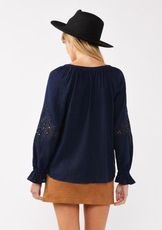 Meet your new boho favorite—our ultra-flowy peasant blouse, crafted from a dreamy rayon and linen blend for a cool, breathable feel. Featuring long sleeves with pretty embroidered lace details, ruffled elastic cuffs, and a split v-neckline with ties. Tuck it into your favorite denim for an effortless Fall ensemble that feels as timeless as it looks. Embroidered Lace insert Relaxed fit Long sleeve Ruffled elastic wrist cuff Hip length Split v-neckline with ties Women's bohemian top Dry clean recommended or hand wash cold Model is 5'9, wearing a size S.Style: I-15434W-SAH Bohemian Cotton Peasant Top With Lace Trim, Chic Long Sleeve Embroidered Top For Fall, Bohemian Embroidered Long Sleeve Top In Relaxed Fit, Summer Long Sleeve Embroidered Top With Lace Trim, Bohemian Embroidered Top With Long Sleeves, Bohemian Tops With Lace Sleeves For Fall, Summer Embroidered Long Sleeve Top With Lace Trim, Chic Long Sleeve Embroidered Cotton Top, Spring Embroidered Long Sleeve Top With Ruffles