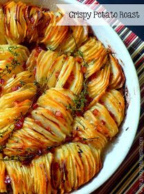 baked potato dish with herbs and seasoning in a white bowl on a striped tablecloth