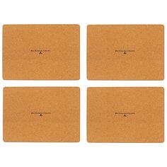 four cork placemats with black writing on the front and one has a white background