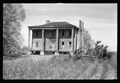 black and white photograph of an old abandoned house