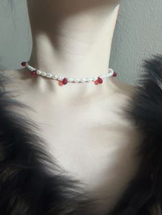 This stunning gothic pearl choker is a perfect blend of elegance and darkness. Crafted from natural freshwater pearls, each drop of deep red glass evokes the essence of blood, adding a bold, dramatic flair to the timeless pearl design. Paired with matching earrings, this set is ideal for those who love to express their unique style with a touch of gothic romance. Product Details Materials: Freshwater pearls, glass drops, all metals are stainless steel Necklace length: Adjustable from 13" to 16" Closure: Lobster clasp Style: Gothic, dark elegance, blood-inspired Handmade with care and detail Halloween Choker, Dark Elegance, Gothic Romance, Style Gothic, Earrings Halloween, Pearl Design, Blood Red, Wedding Jewellery Necklace, Pearl Choker