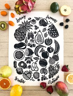 an image of fruits and vegetables drawn in black on white paper surrounded by cut up fruit