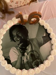 a cake with the number twenty five on it and an image of a man's face