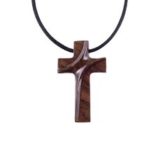 a wooden cross on a black cord necklace