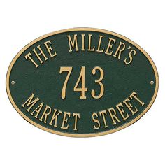 the miller's market street sign is black and gold with white lettering on it