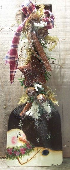 a christmas ornament hanging on the side of a wooden wall