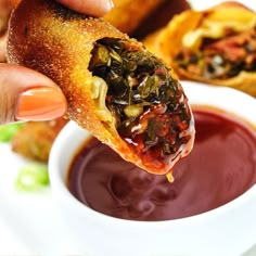 a person is dipping sauce into some food