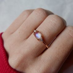 Rainbow Moonstone Ring-Fire Moonstone Ring-Oval Moonstone Ring-Dainty Moonstone Ring-Stackable Ring-Wedding Gold Band-14k Solid Gold Ring ABOUT RING Gemstone - Natural Rainbow Moonstone Gemstone Size -  5x7mm  Gemstone shape - Oval Cut Accent Stone - Cubic Zirconia ------------------------------------------------------------------------------------------------------------------------------------------------- Fast Shipping: It will take 1-8 business days to send out your item Material: 22k/20k/18 Gold Moonstone Ring, Forever Rings, Gold Chain Choker, Dainty Choker, Ringe Gold, Solid Gold Ring, Rainbow Moonstone Ring, Natural Rainbow, Oval Stone