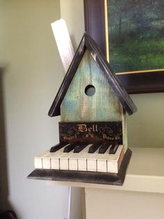 a bird house made out of piano keys