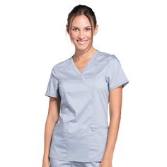 PRICES MAY VARY. FLATTERING FIT, SIZES UP TO 5XL - Workwear Revolution womens scrubs have the sizes you want and the features you need. Available in sizes from XXS to 5XL. These Modern Classic fit mock wrap nurse scrubs for women are designed for comfort and maximum durability. Center back length (size S) is 26”. (Scrub pants sold separately.) STYLE AND FUNCTION - This comfortable mock wrap scrub top offers healthcare workers a uniform that is professional, hardworking and stylish while being af Womens Scrub Tops, Safety Clothing, Nurse Uniform, Medical Uniforms, Scrubs Nursing, Womens Scrubs, Medical Scrubs, Scrub Pants, Work Wear Women