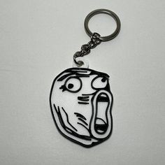 a keychain with a cartoon face on it