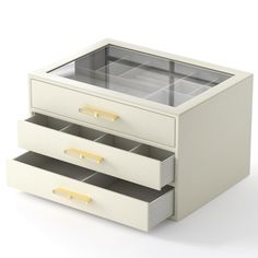 two drawers with gold handles on each side and one drawer open to show the contents