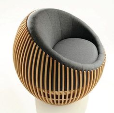 a chair made out of wood and grey fabric