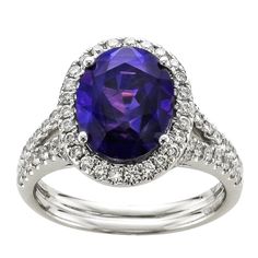 6.02 Oval Color Changing Purple Blue Sapphire center stone with .63 carat total weight round brilliant diamonds set in 18 karat white gold ring. Pretty Rings, Blue Sapphire Rings, Brilliant Diamond, White Gold Rings, Blue Sapphire, Sapphire Ring, Round Diamonds, Gold Diamond, Blue And Purple