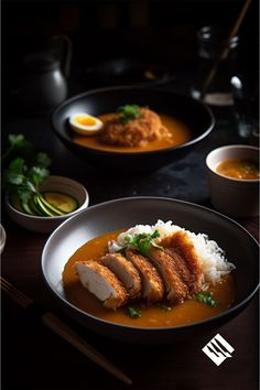 some food is sitting on a table with chopsticks and other dishes around it