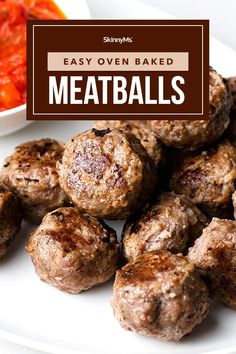 meatballs on a plate with tomato sauce and text overlay that reads easy oven baked meatballs