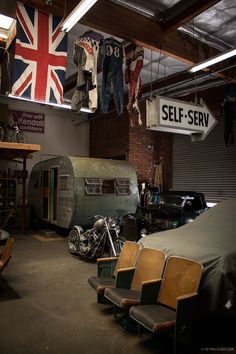 an old motorcycle is parked in a garage