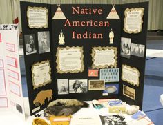 a table topped with pictures and information about native american indians