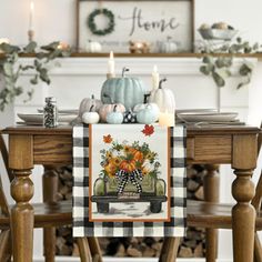 a table with pumpkins and gourds on it in front of a fireplace