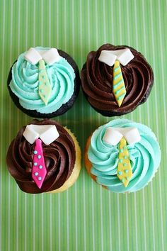 four cupcakes decorated with different colored frosting on a green tablecloth that says father's day special