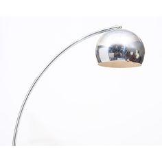 a chrome plated floor lamp with a white background