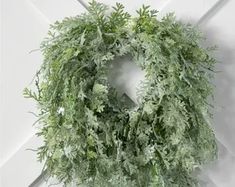 a green wreath hanging on the wall