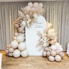 a table with balloons and flowers on it