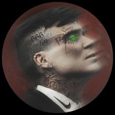 a man with green eyes and tattoos on his face is shown in a circular photo