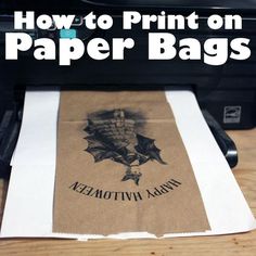 a brown paper bag sitting on top of a black and white printer with the words how to print on it