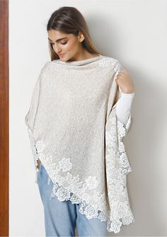 This is a classic knitted oatmeal mélange poncho crafted from a very fine wool. It is elevated with the intricate application of a contrasting ivory Chantilly lace border. Striking and stylishly warm, this poncho makes for a head turning addition to any outfit. Elegant Beige Poncho For Fall, Beige Poncho For Layering, One Size Beige Poncho For Layering, White Poncho For Layering, Elegant Beige Cape Poncho, Elegant Beige Poncho, Elegant White Poncho For Winter, Elegant White Winter Poncho, Cozy Cream Poncho With Long Sleeves