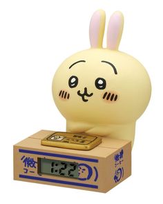 an alarm clock that is shaped like a rabbit