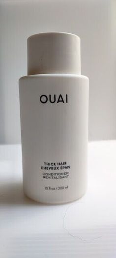 OUAI Thick Hair Conditioner  Full Size - 10 fl oz / 300 mL  Free of Parabens & Phthalates For thick hair, this color-safe conditioner deeply moisturizes to fight frizz, nourish & repair. It also leaves you hair looking & smelling amazing. Hair Type: Thick Hair Texture: Coily, Curly, Straight, and Wavy Hair Concerns: - Frizz - Dryness - Shine Key Benefits:  - Strengthens and adds shine - Hydrates and eliminates frizz - Repairs and detangles Formulation: Lotion Highlighted Ingredients: - Marshmallow Root Extract: Softens, moisturizes, and detangles. - Shea Butter: Hydrates and locks in moisture. - Avocado Oil: Prevents breakage and strengthens. Ingredient Callouts: Free of sulfates SLS and SLES, parabens, formaldehydes, formaldehyde-releasing agents, phthalates, mineral oil, retinyl palmitat Ouai Thick Hair, Straight And Wavy Hair, Hair Concerns, Marshmallow Root, Amazing Hair, Hair Texture, Thick Hair, Avocado Oil, Hair Conditioner