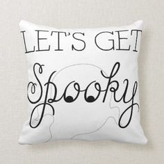 a white pillow with black lettering that says, let's get spooky