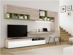 a modern living room with white furniture and green shelves on the wall, along with an entertainment center