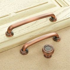 a close up of two handles on a door