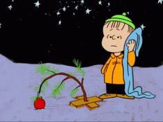 a charlie brown christmas card with an apple and tree in the snow, holding a scarf around his neck