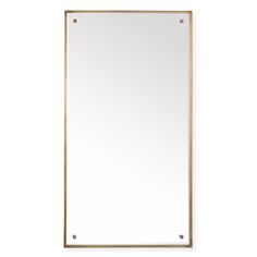 a gold framed mirror on a white wall