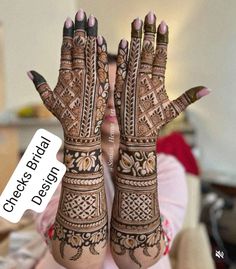 a woman is holding her hands up with hendi designs on it