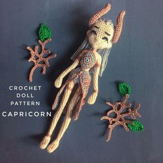 crochet doll pattern capricorn with green leaves and starfish on grey background