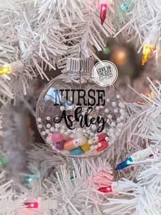 a christmas ornament hanging from the side of a tree with candy in it