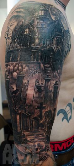 a man's half sleeve with an image of a house on the back of his arm